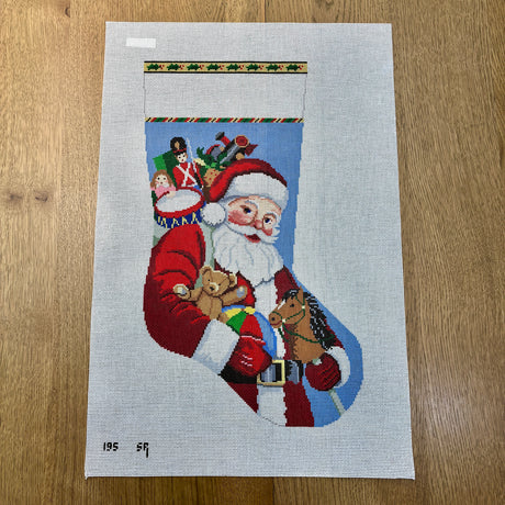 Santa Carrying Toys Stocking Susan Roberts